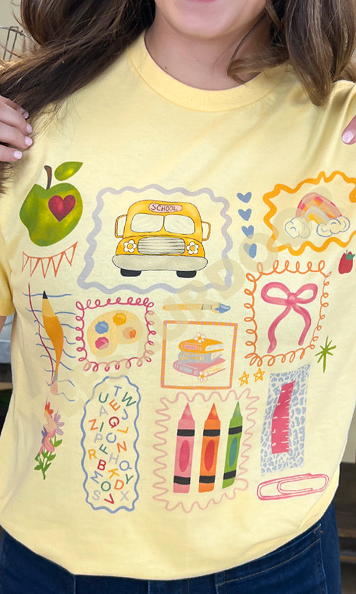 Bright yellow All the Teacher Things Graphic Shirt features playful school-themed designs, perfect for educators.