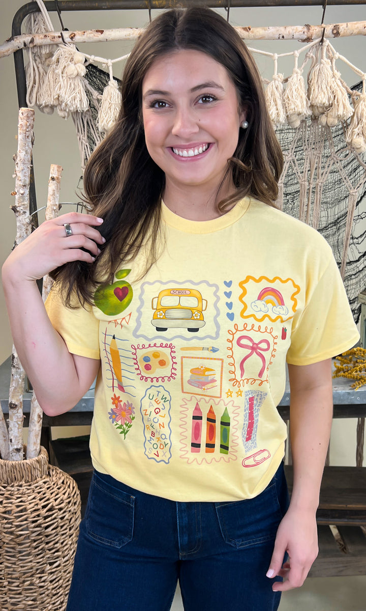 Bright yellow All the Teacher Things Graphic Shirt features fun school-themed designs, perfect for educators.