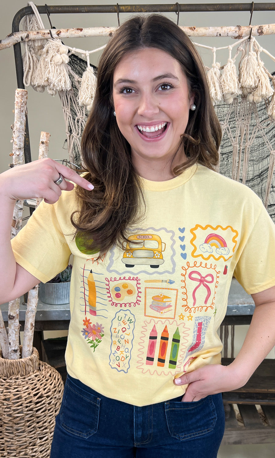 Bright yellow All the Teacher Things Graphic Shirt featuring fun school-themed designs, perfect for educators.