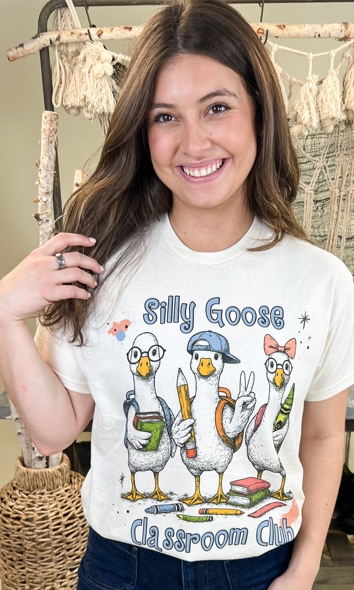 Silly Goose Classroom Club Teacher Graphic Shirt features cute geese with school supplies, perfect for educators.