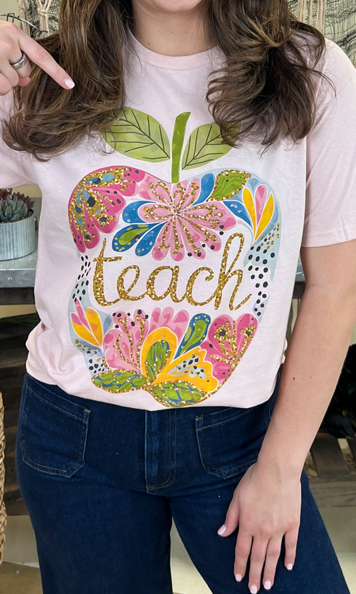 Floral Glitter Apple Teacher Graphic Shirt featuring vibrant design and sparkly accents, perfect for educators.