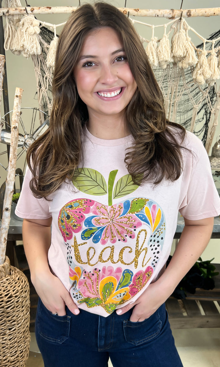 Stylish Floral Glitter Apple Teacher Graphic Shirt featuring colorful apple design, perfect for educators.
