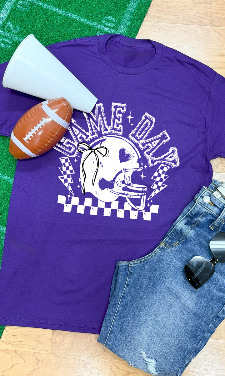 Purple Game Day Football Bow Graphic T-Shirt with helmet design, perfect for cheering on your team in style.