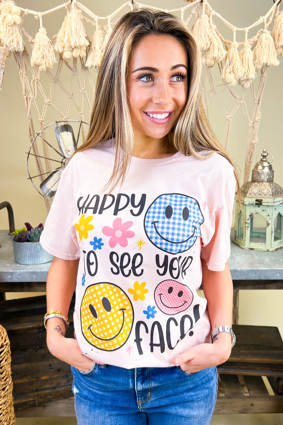 Bright and cheerful, the Happy To See Your Face Graphic Shirt features fun smiley designs, perfect for casual outings.
