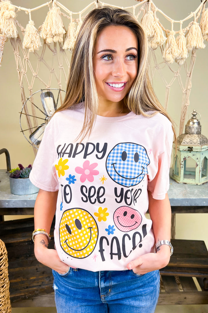 Bright and cheerful, the Happy To See Your Face Graphic Shirt features fun smiley designs, perfect for casual outings.