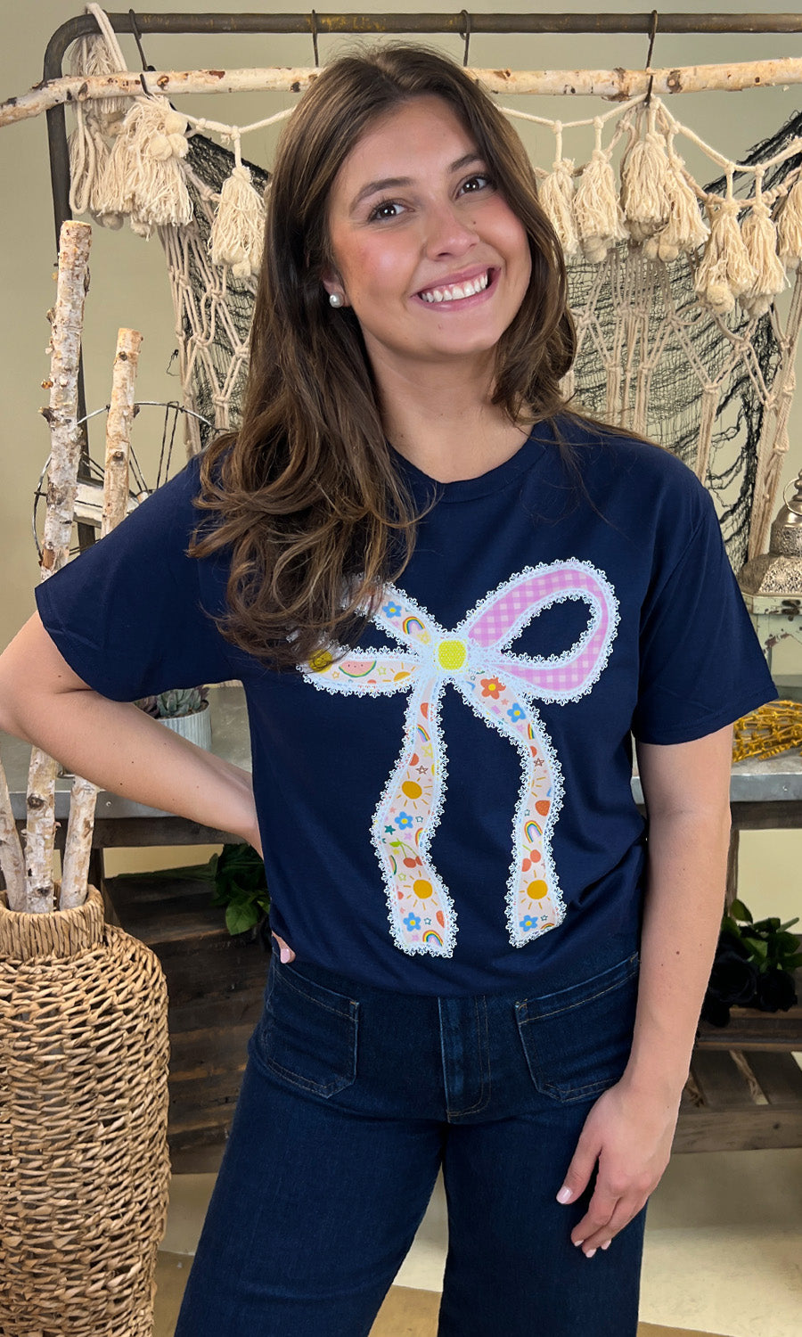 Charming Teacher Bow Graphic Shirt displayed on a model, perfect for stylish educators.