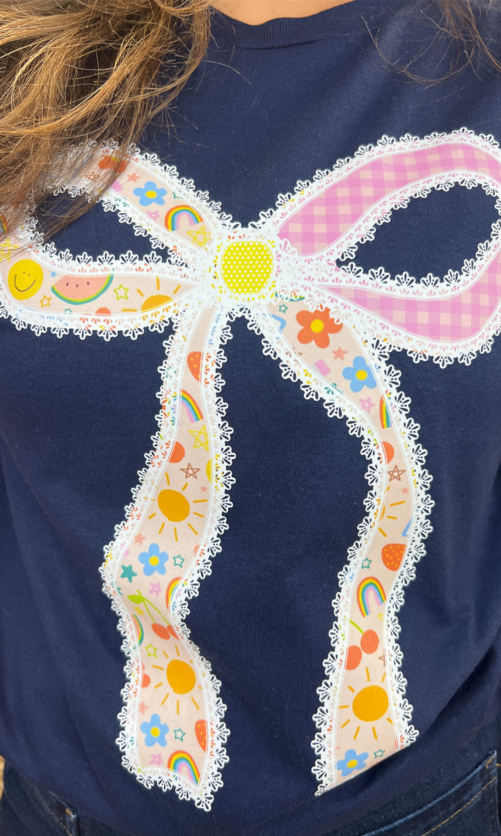 Colorful Teacher Bow Graphic Shirt featuring a playful bow design and cheerful patterns, perfect for educators.
