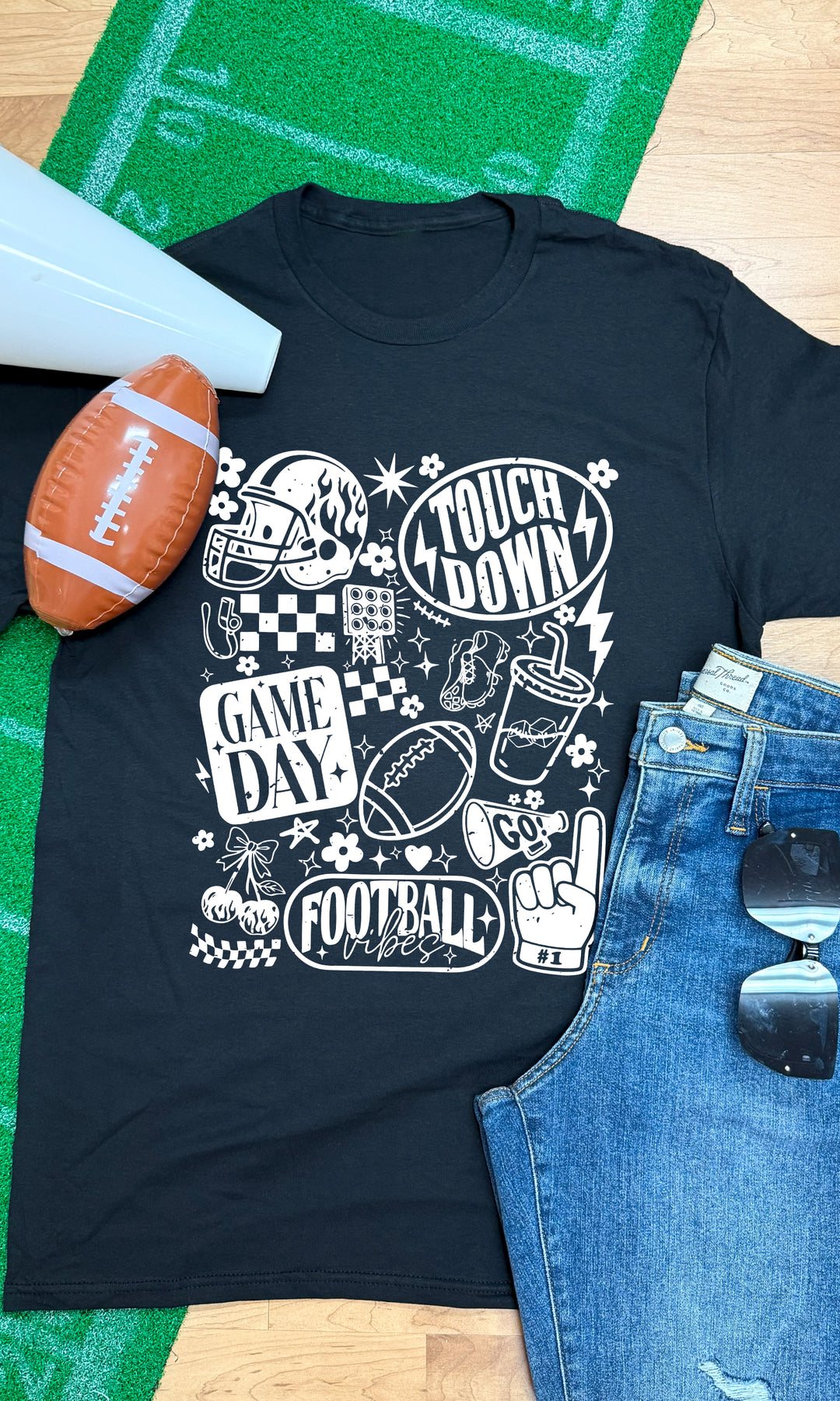 Stylish Vintage Football Season Graphic T-Shirt on a green turf background, perfect for game day vibes.