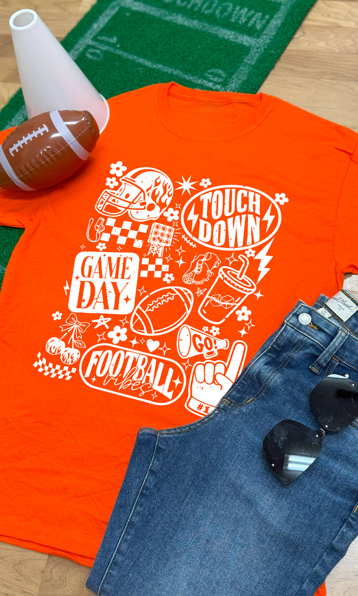 Bright orange Vintage Football Season Graphic T-Shirt featuring fun football-themed designs, perfect for game day vibes.