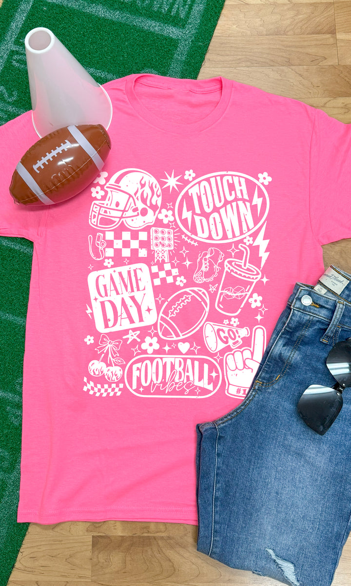 Bright pink Vintage Football Season Graphic T-Shirt featuring fun football-themed designs, perfect for game day.