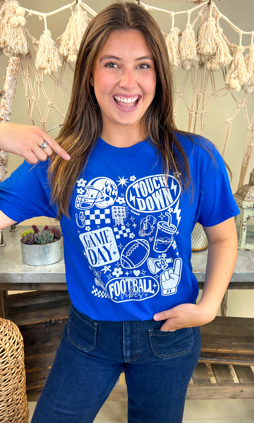 Bright blue Vintage Football Season Graphic T-Shirt featuring fun football-themed designs, perfect for game day.