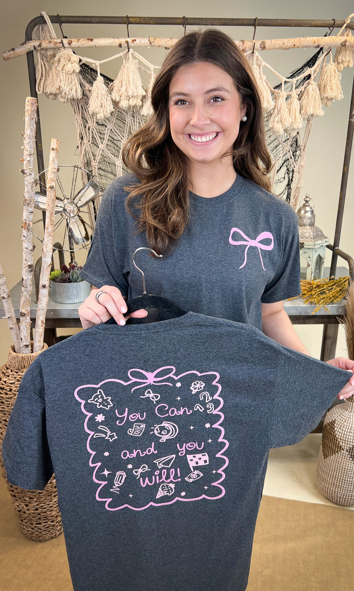Stylish You Can and You Will Teacher Graphic Shirt displayed by a smiling model, perfect for educators.