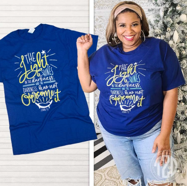 The Light Shines in the Darkness Christmas T-Shirt